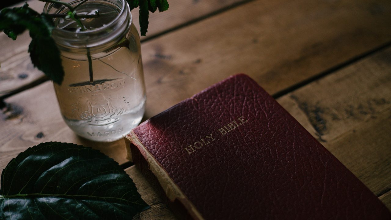 An open Bible resting on a table